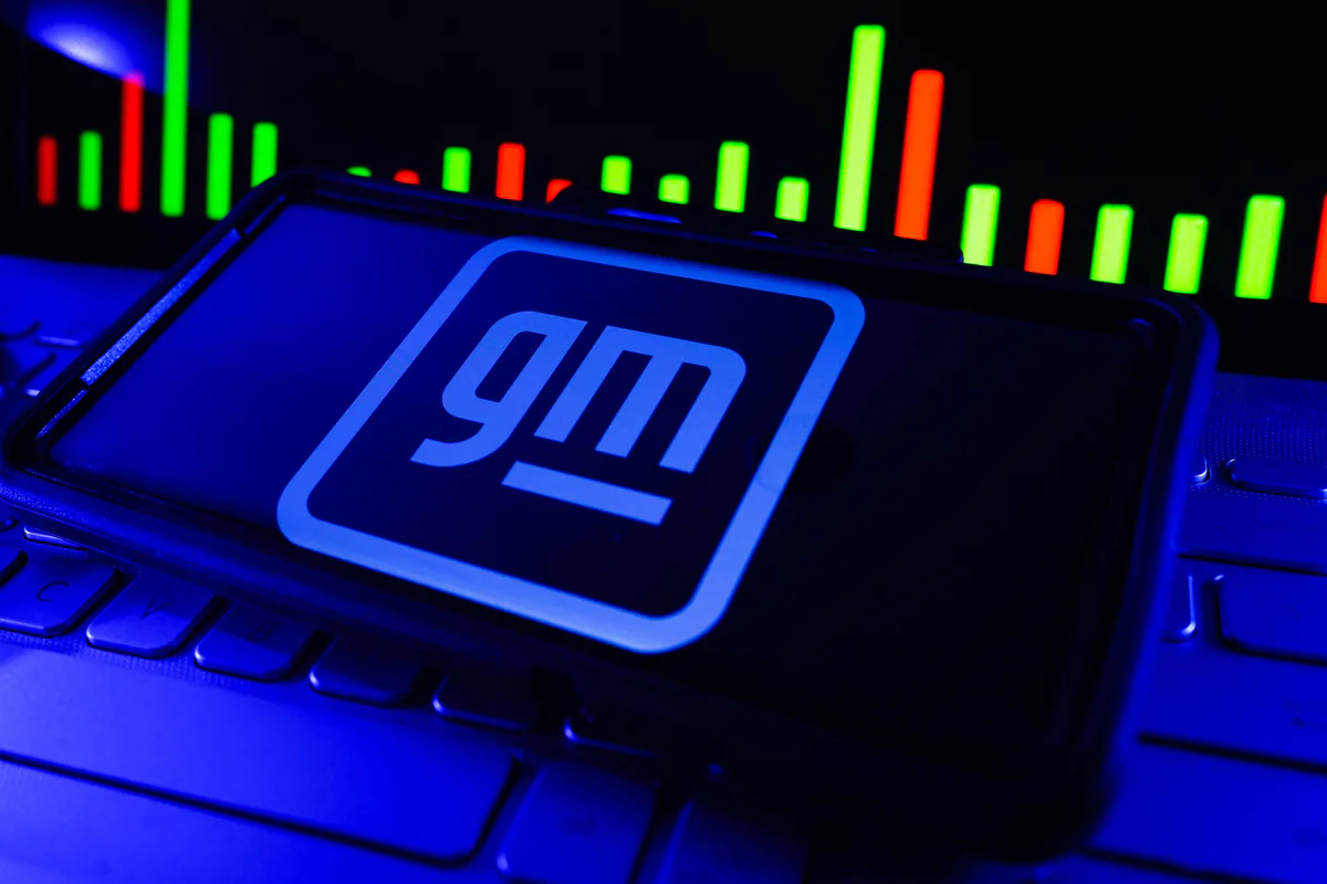 Nasdaq MarketSite electronic stock exchange display in Times Square, New York, illustrating General Motors' planned listing transfer from the NYSE