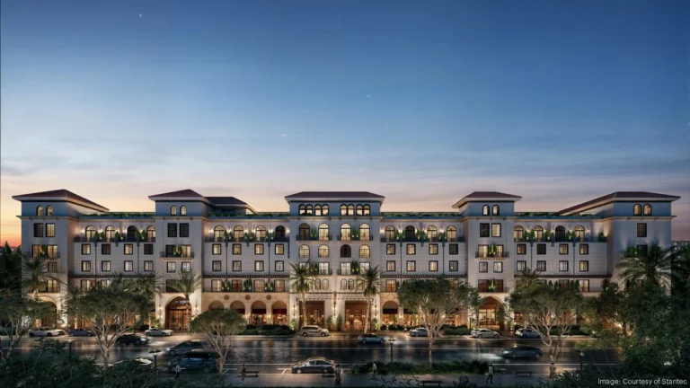 Exterior of The Nora Hotel at 1135 North Railroad Avenue in West Palm Beach's Nora District, featuring Mediterranean Revival architecture and landscaped entrance