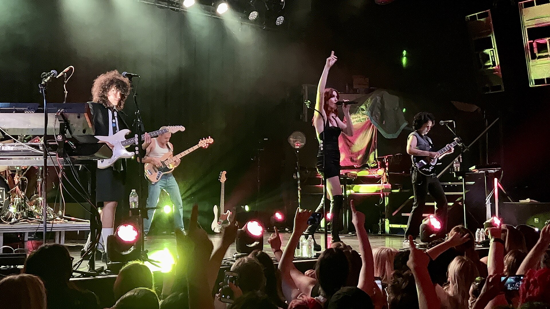 MUNA performing live on stage
