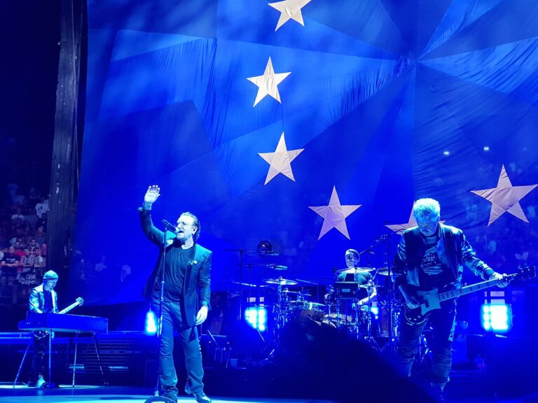 U2 performing in concert (file photo, 2018)