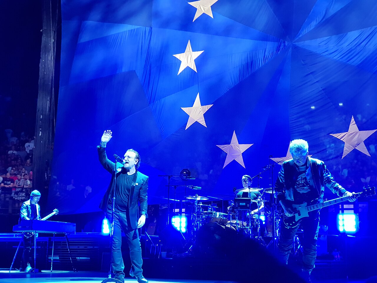 U2 performing in concert (file photo, 2018)
