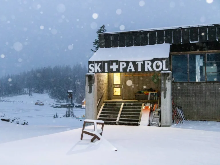Snow-covered roadway at Yellowstone National Park's North Entrance near Gardiner, Montana, during winter